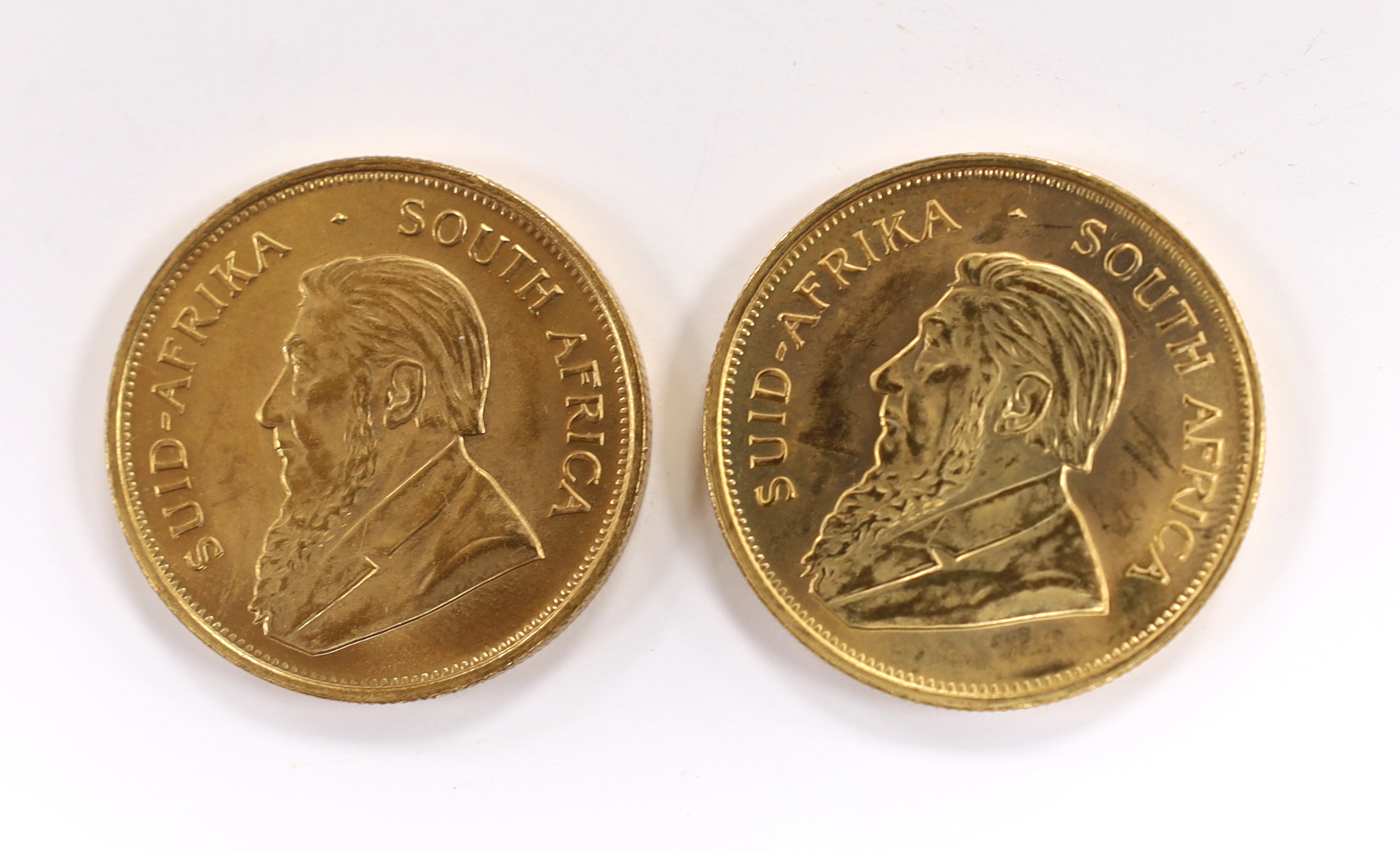 Gold coins, South Africa, two gold 1oz. Krugerrands, 1975, near UNC (2oz.)